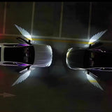 Car Rearview Mirror Angel Wings Lamp – LED Courtesy Light illuminating two cars in a parking lot.